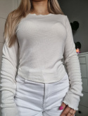Cream blouse with ruffle on the side