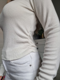 Cream blouse with ruffle on the side